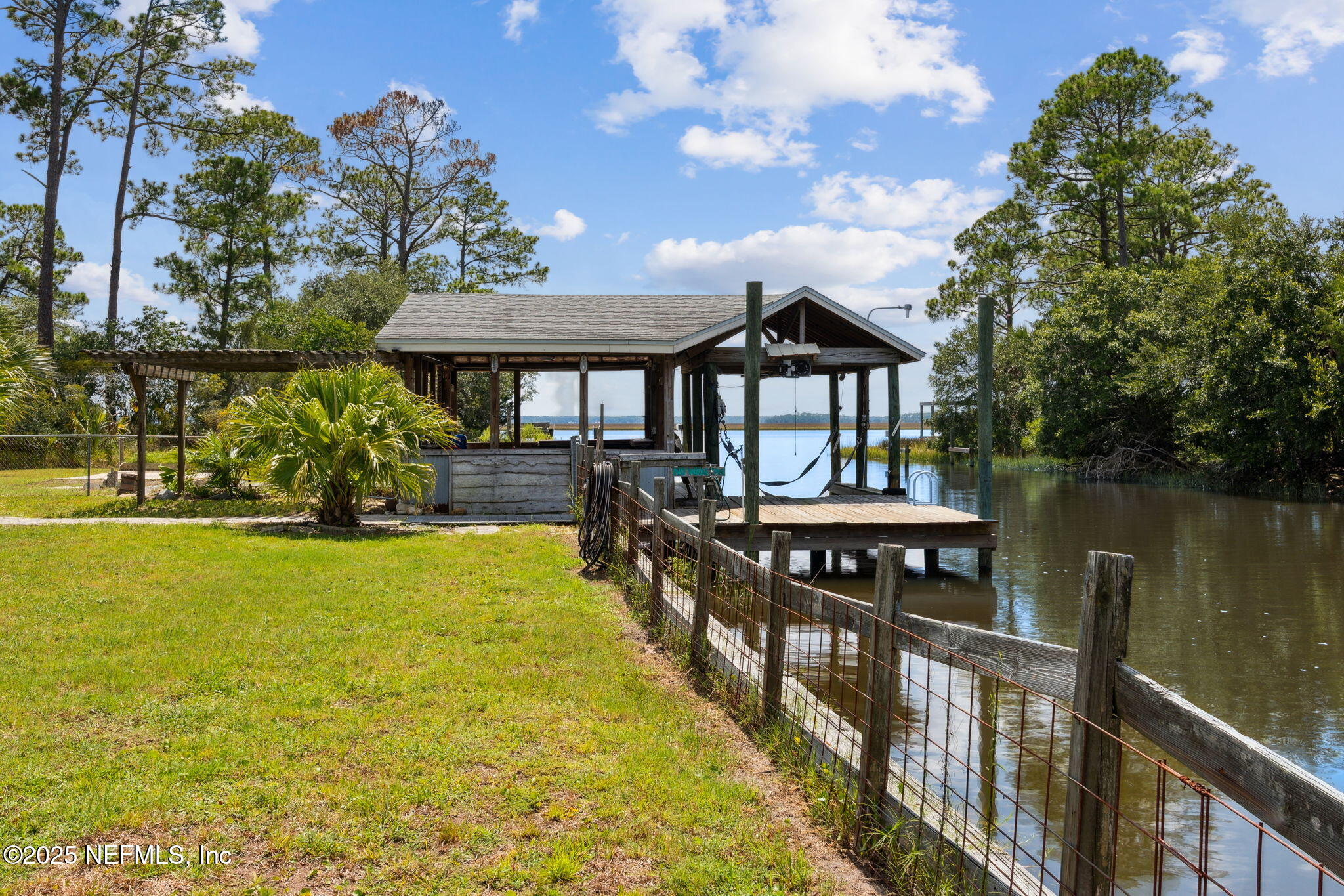 16062 Shark Road West Jacksonville, FL 32226 - Photo 39 of 43 a view of a house with pool and lake view