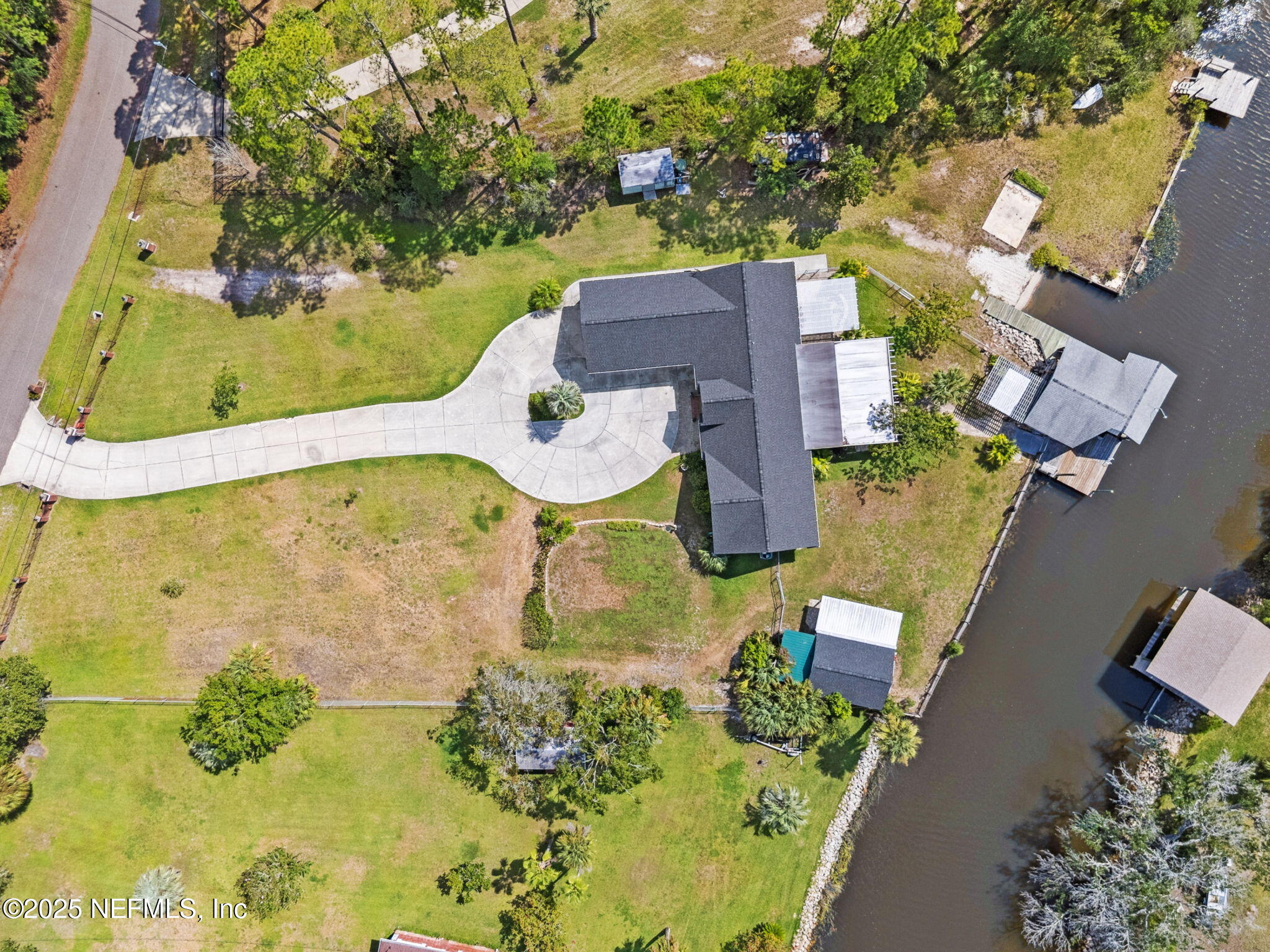16062 Shark Road West Jacksonville, FL 32226 - Photo 43 of 43 an aerial view of a house with a yard and swimming pool