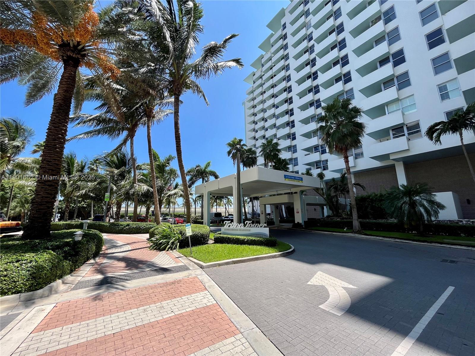 2899 Collins Avenue, Unit 1414 Miami Beach, FL 33140 - Photo 15 of 26 a view of a building with a yard