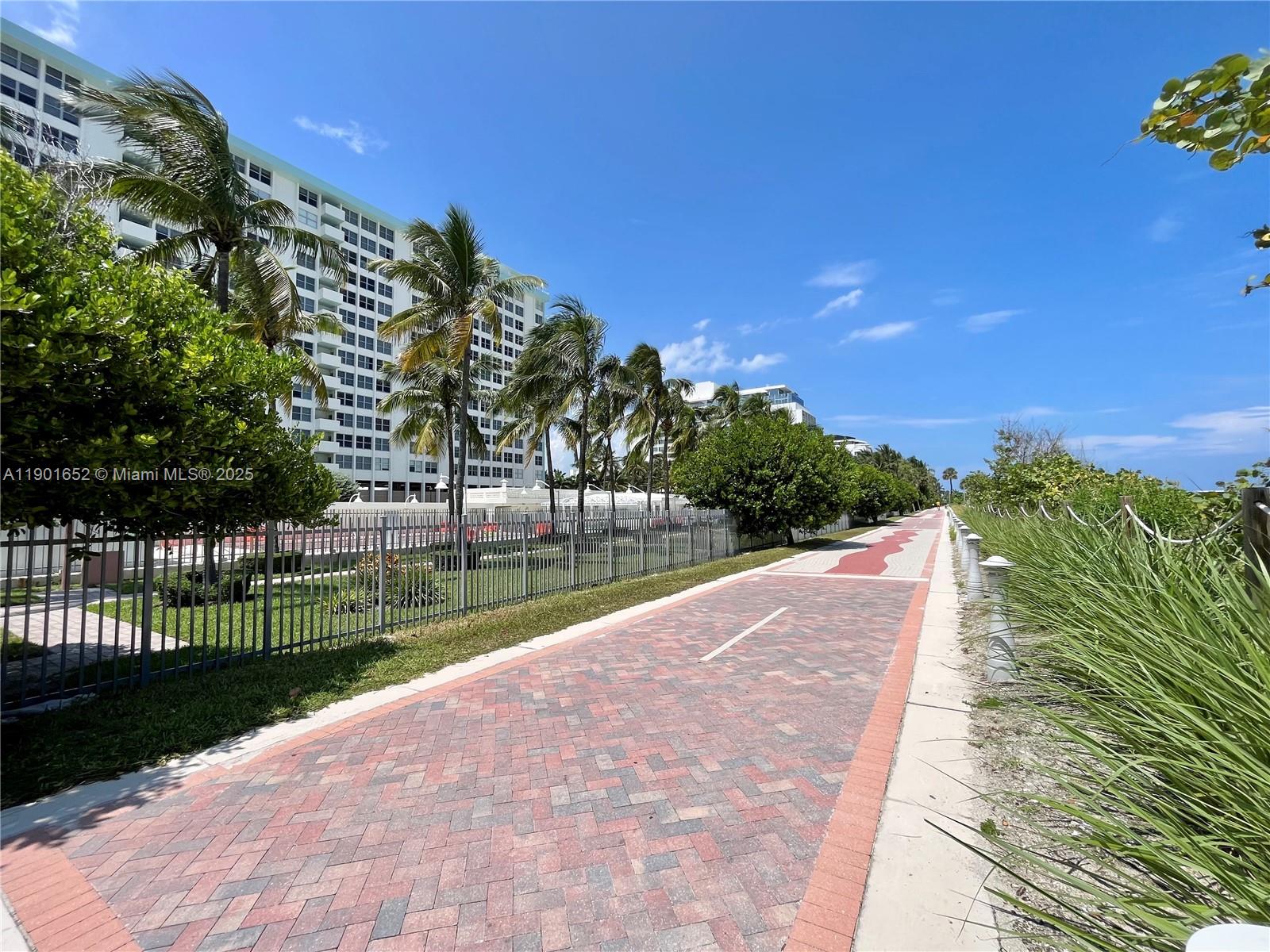 2899 Collins Avenue, Unit 1414 Miami Beach, FL 33140 - Photo 21 of 26 a view of a lake with a garden