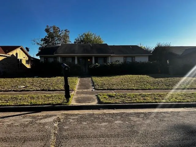 a view of a yard with an outdoor seating