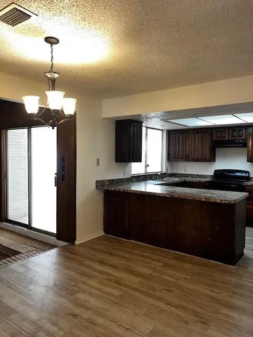 a kitchen with a refrigerator and a sink