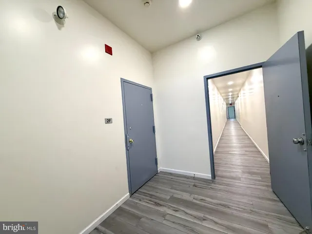 a front view of a building with parking