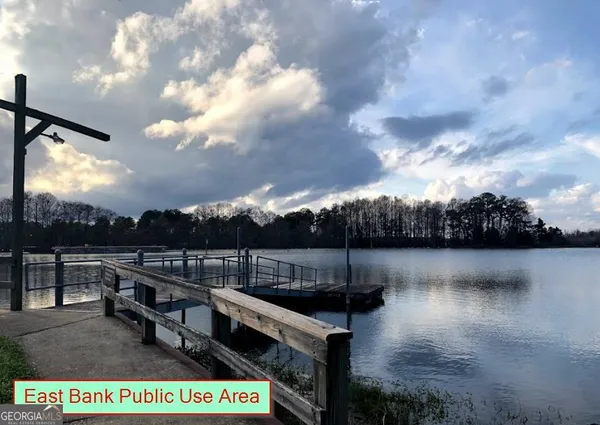 a view of a lake with sitting area