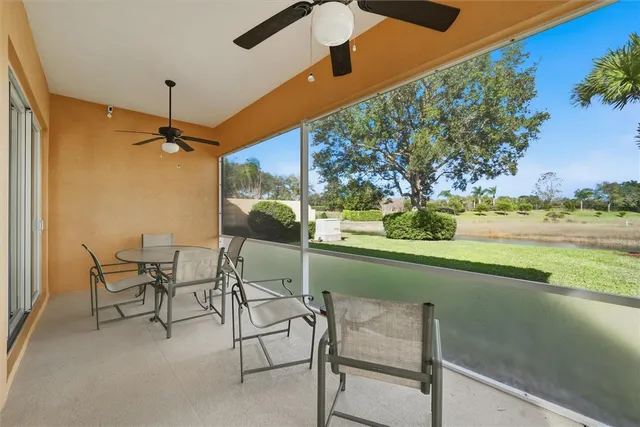 a bathroom with a granite countertop sink a toilet and bathtub