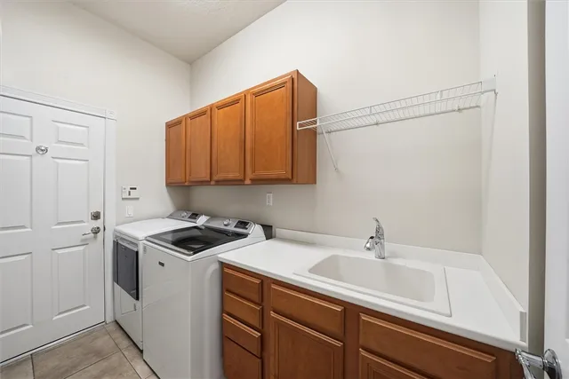 a view of residential house with lake and green space