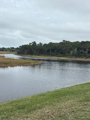 a kitchen with stainless steel appliances a sink and a refrigerator