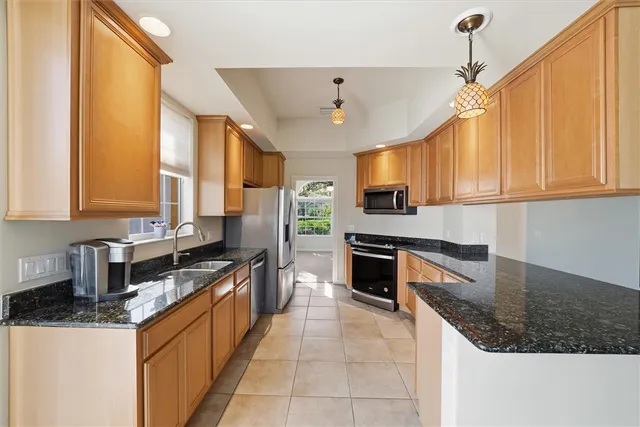 an empty room with fan and windows