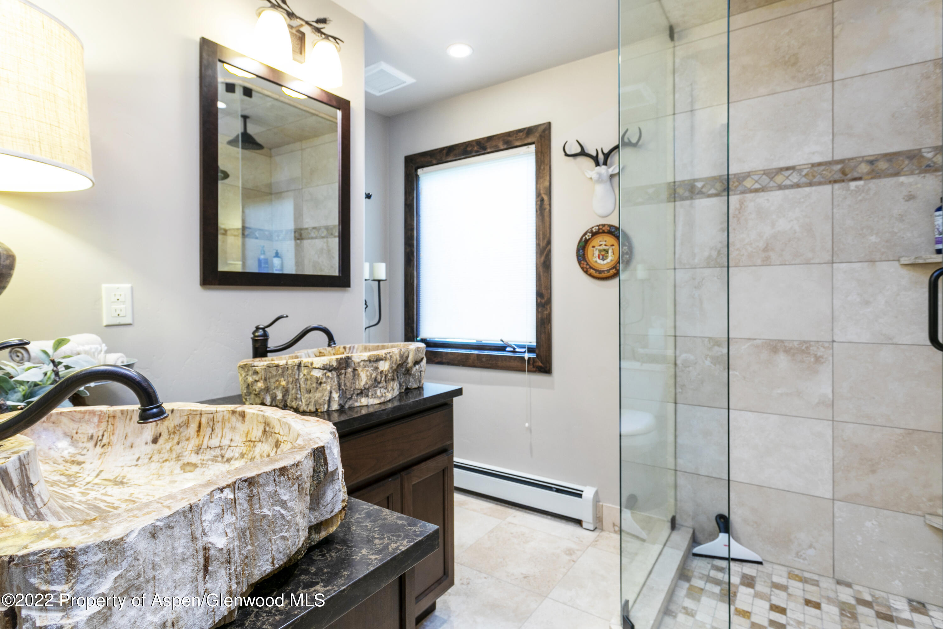 850 Main Street, Unit B Minturn, CO 81645 - Photo 13 of 24 a bathroom with a granite countertop sink and a mirror