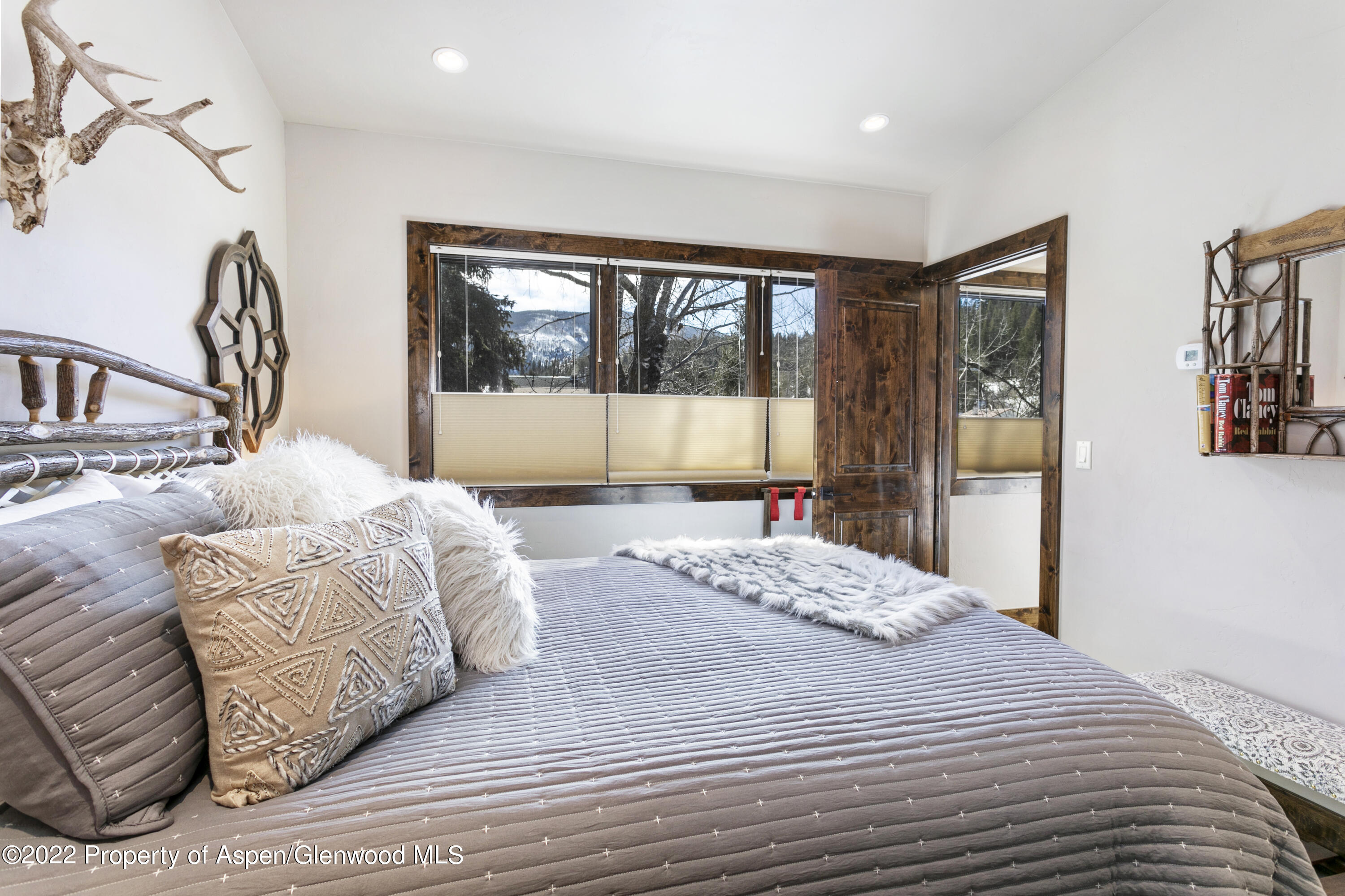 850 Main Street, Unit B Minturn, CO 81645 - Photo 16 of 24 a bedroom with a large bed and a large window