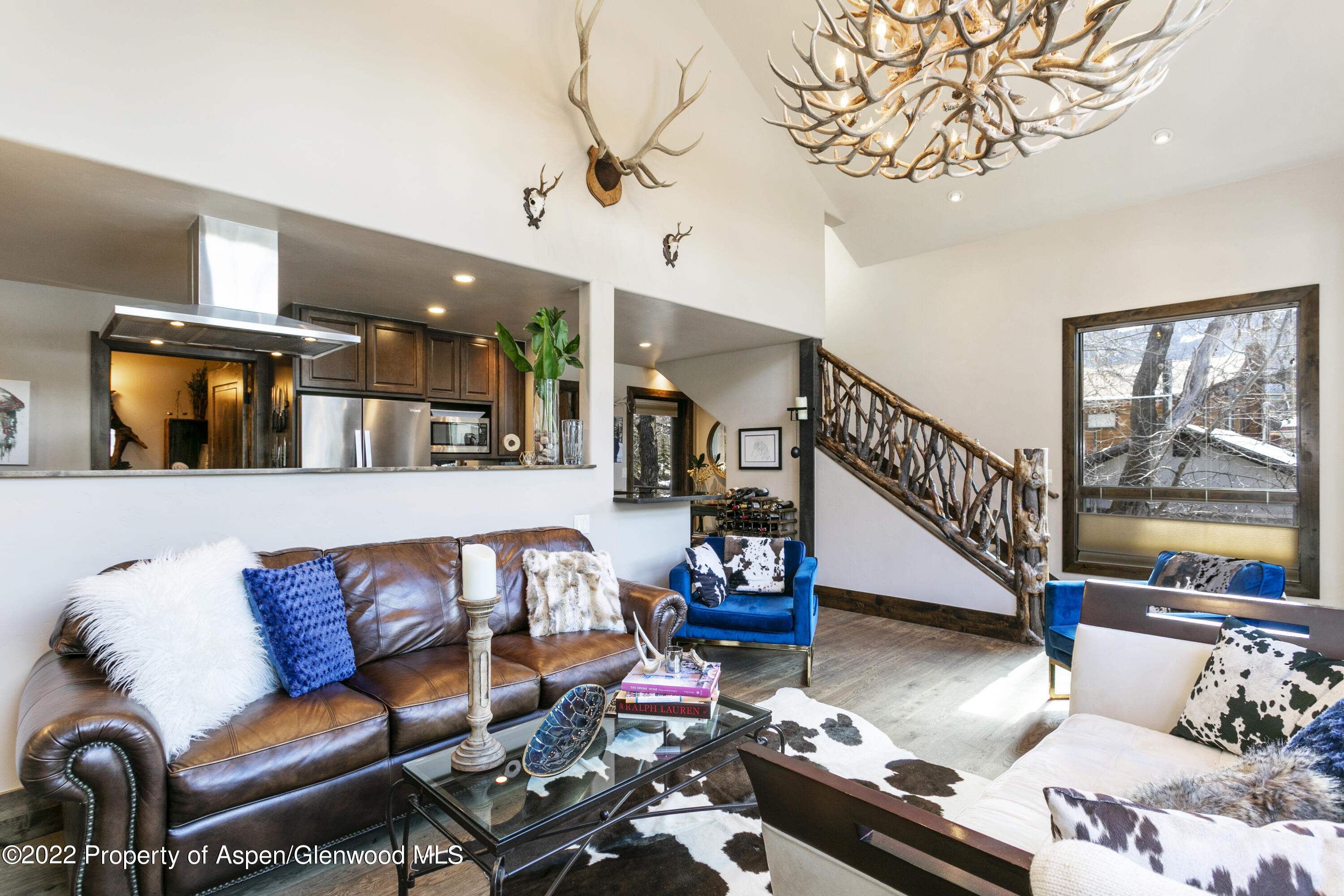850 Main Street, Unit B Minturn, CO 81645 - Photo 3 of 24 a living room with furniture fireplace and a flat screen tv
