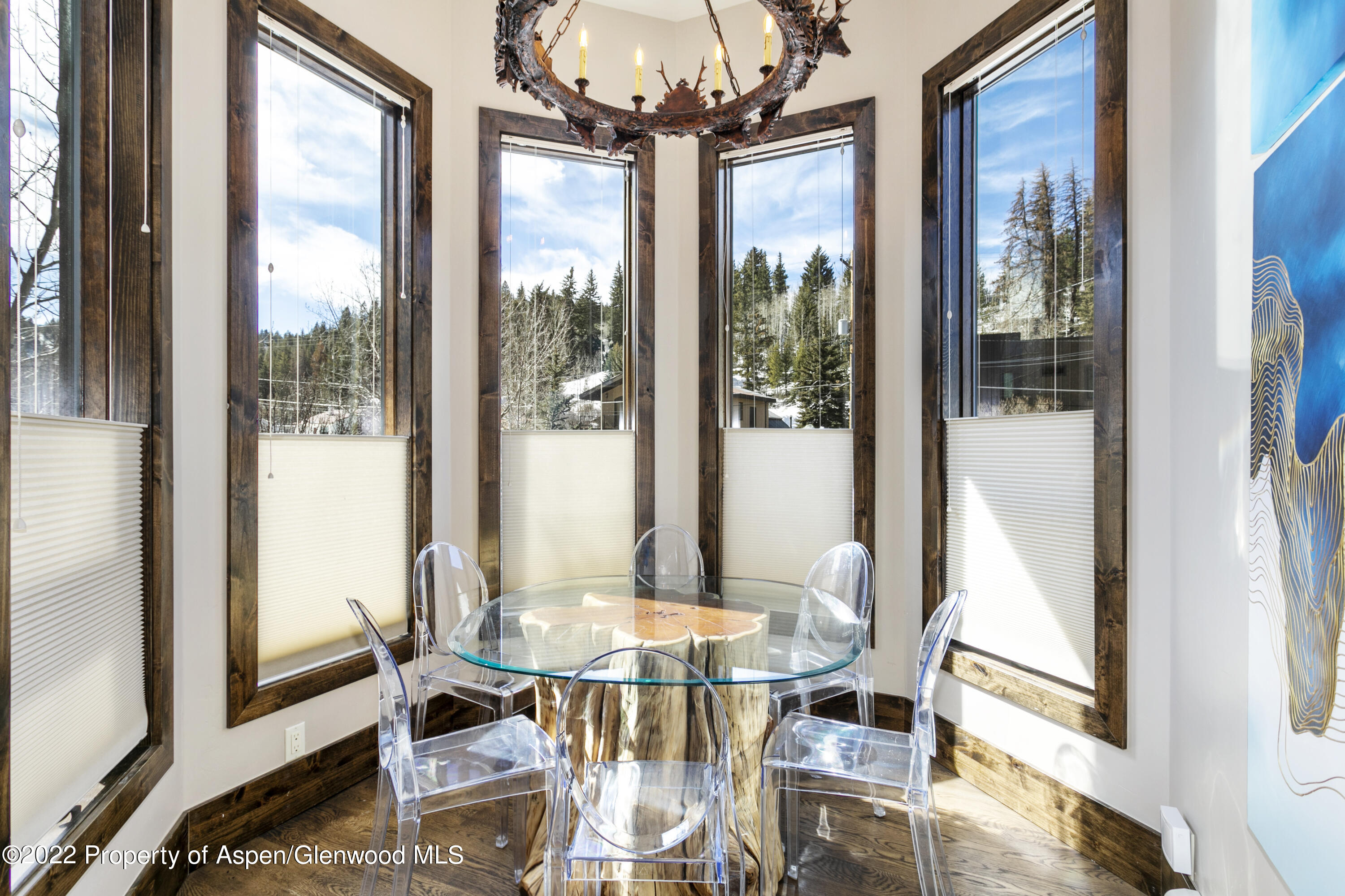 850 Main Street, Unit B Minturn, CO 81645 - Photo 5 of 24 a view of a dining room with furniture wooden floor and chandelier