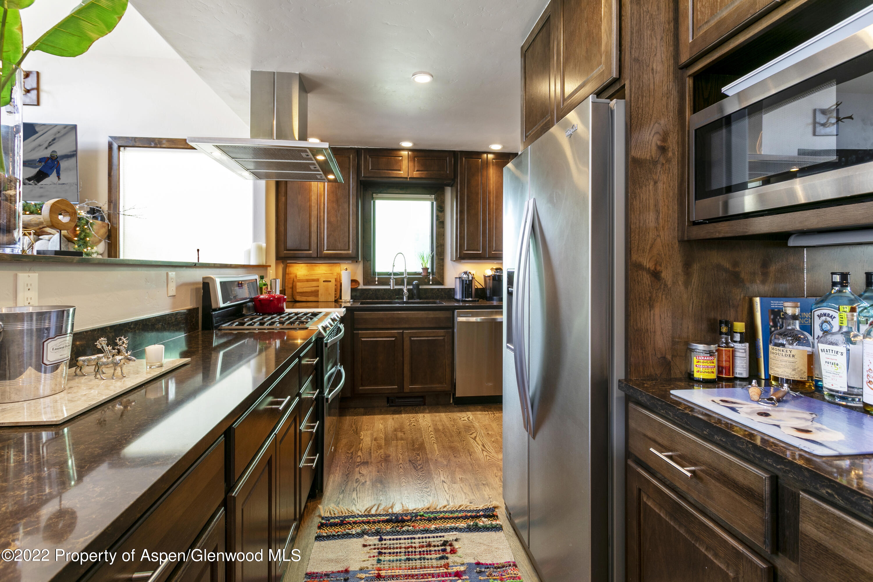 850 Main Street, Unit B Minturn, CO 81645 - Photo 7 of 24 a kitchen with stainless steel appliances granite countertop a sink stove and refrigerator