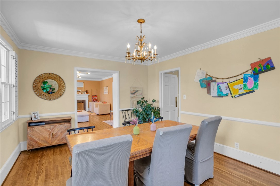 1107 Springdale Road Anderson, SC 29621 - Photo 13 of 49 This dining area features hardwood flooring and an elegant chandelier, perfect for memorable gatherings.
