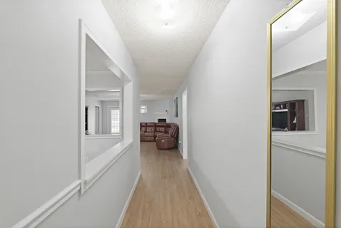 a view of a bedroom from a hallway