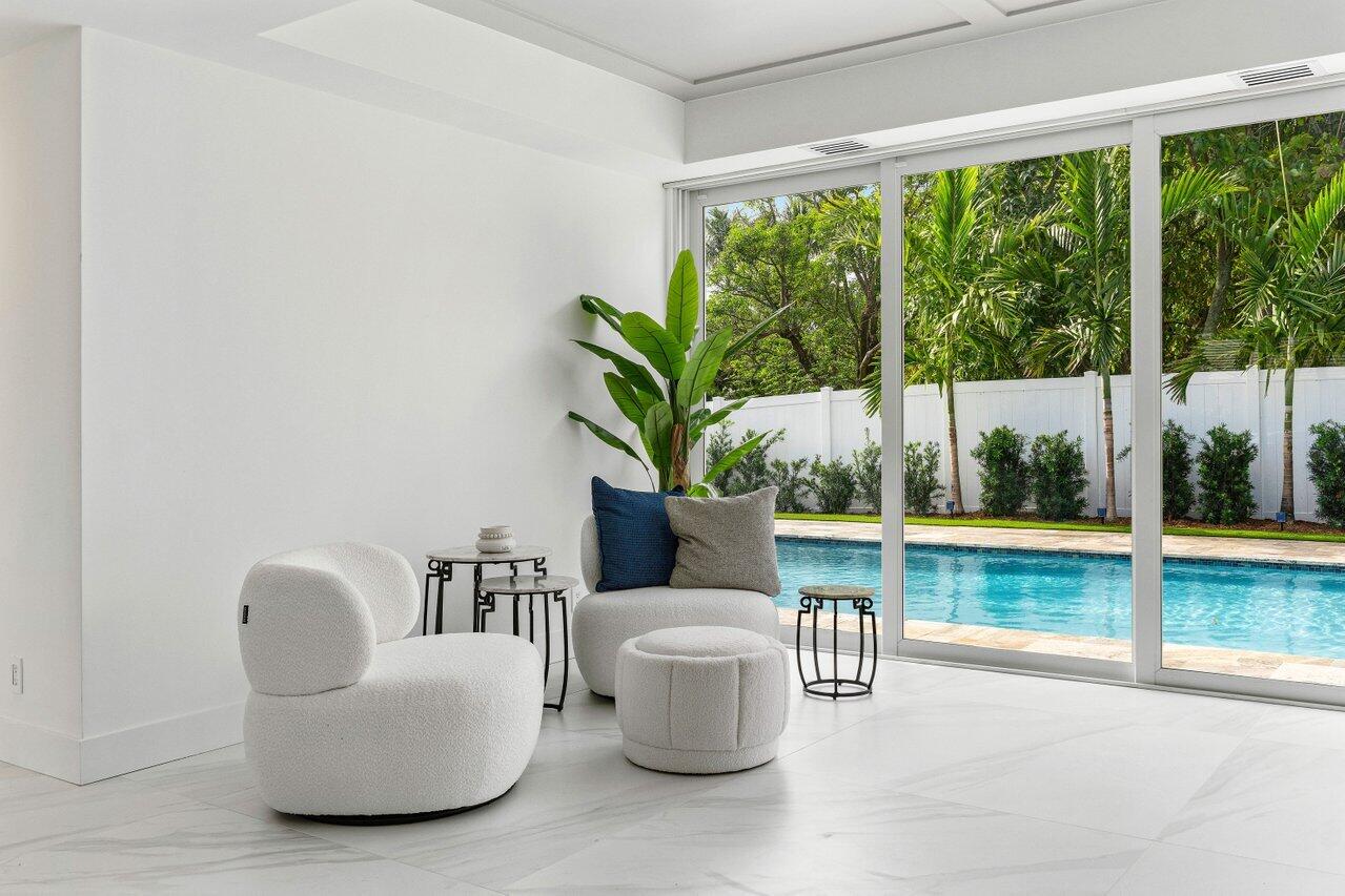 902 Southwest 27th Place Boynton Beach, FL 33435 - Photo 13 of 52 a living room with furniture and a large window