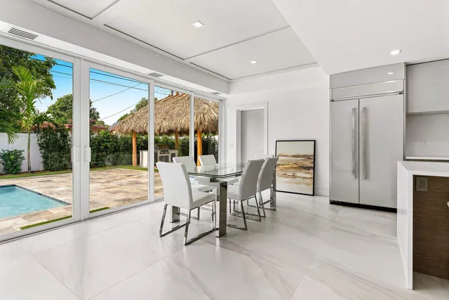 a bedroom with a large bed and a large window