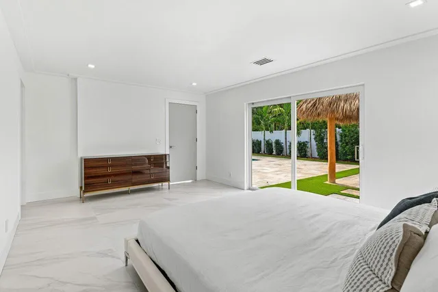a white bath tub sitting in a bathroom and shower