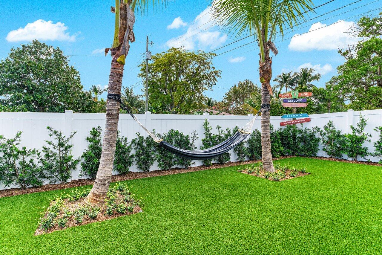 902 Southwest 27th Place Boynton Beach, FL 33435 - Photo 29 of 52 a park with lots of swings and slides