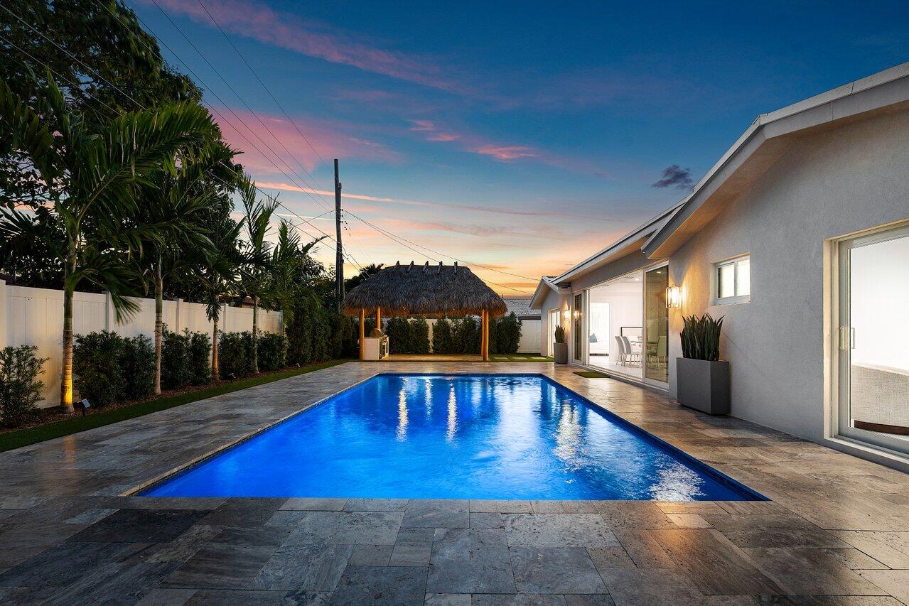 902 Southwest 27th Place Boynton Beach, FL 33435 - Photo 33 of 52 a view of swimming pool with seating space