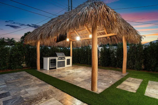 a swimming pool with outdoor seating and yard