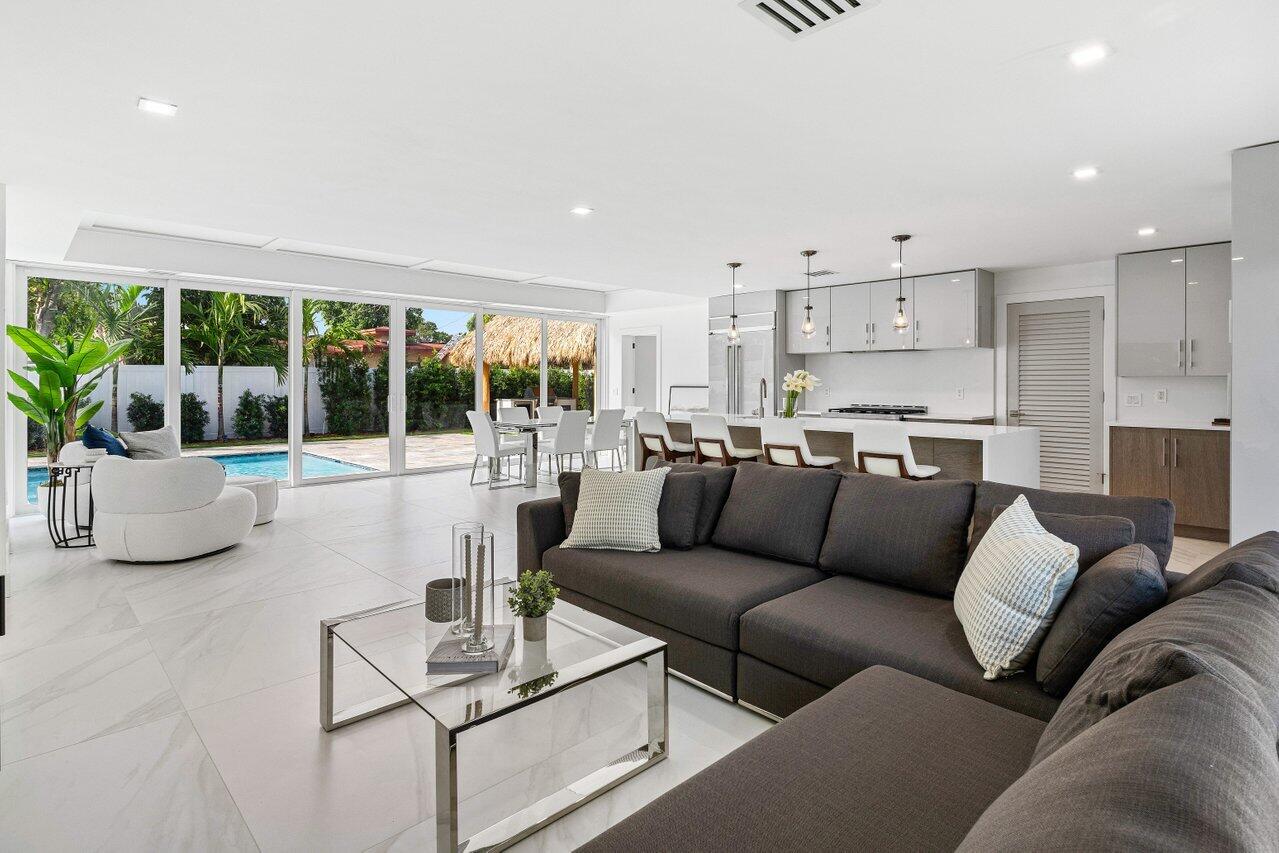 902 Southwest 27th Place Boynton Beach, FL 33435 - Photo 8 of 52 a living room with furniture and a large window