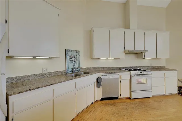 a bedroom with a bed and couch