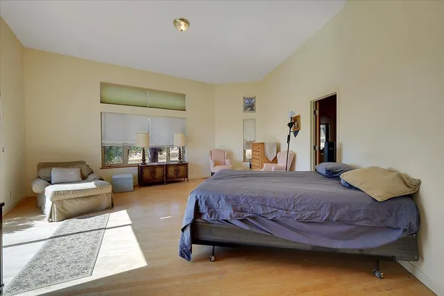 a utility room with a sink a cabinetry and window