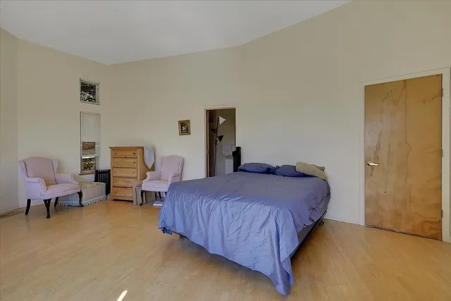 a view of a room with a table and chairs