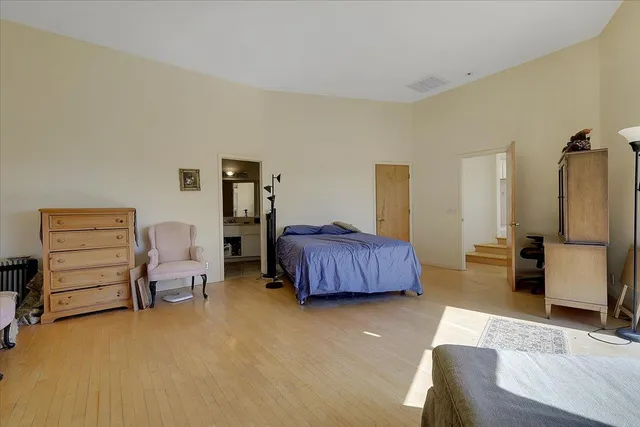 a kitchen with stainless steel appliances kitchen island granite countertop a sink and cabinets