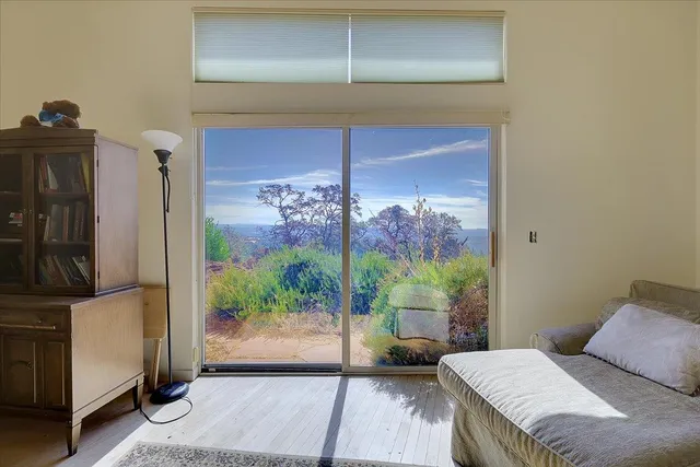 a bathroom with a sink mirror and toilet