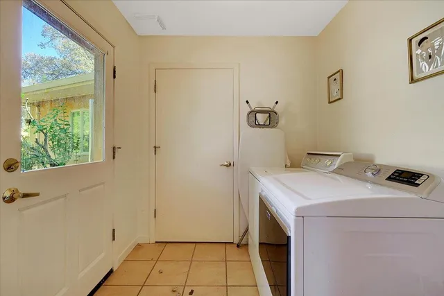 a bathroom with a shower sink and mirror