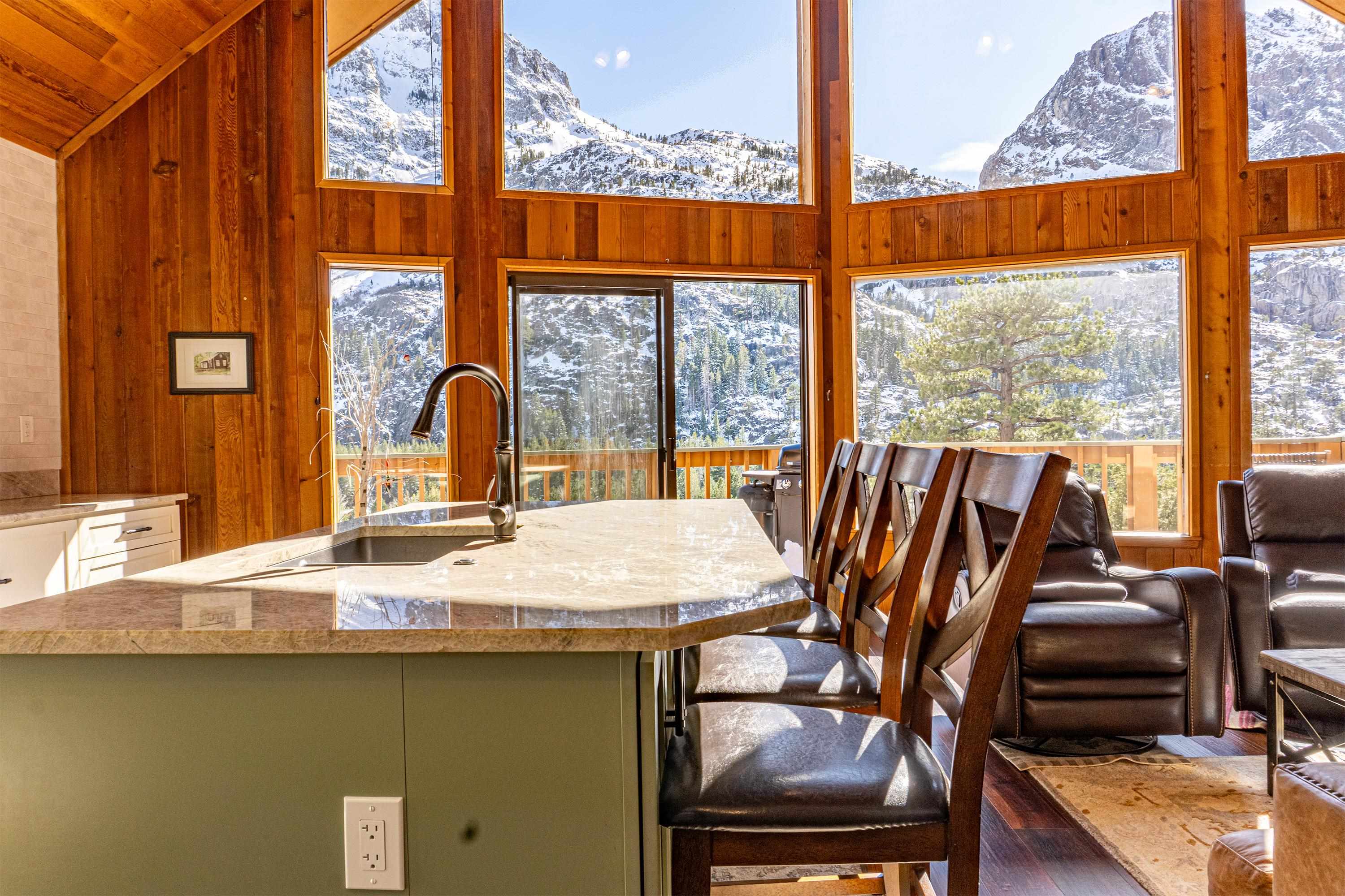 179 Washington Street June Lake, CA 93529 - Photo 10 of 49 Dining space with a lofted ceiling, wood walls, and a mountain view