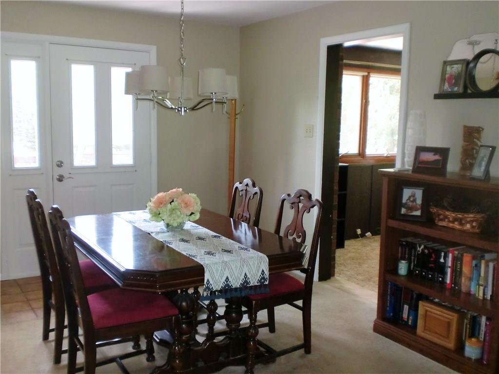 290 Manor Road Wexford, PA 15090 - Photo 13 of 25 The Dining Room opens to the rear 27x14 Deck and the Family Room is through that doorway. Hardwood flooring under the carpet.