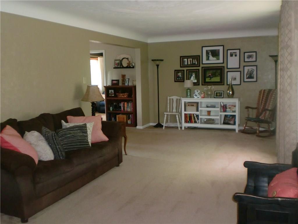 290 Manor Road Wexford, PA 15090 - Photo 3 of 25 This Living Room is 25x11, has a very large front window and a beautifully plastered ceiling. There is hardwood under the carpeting.