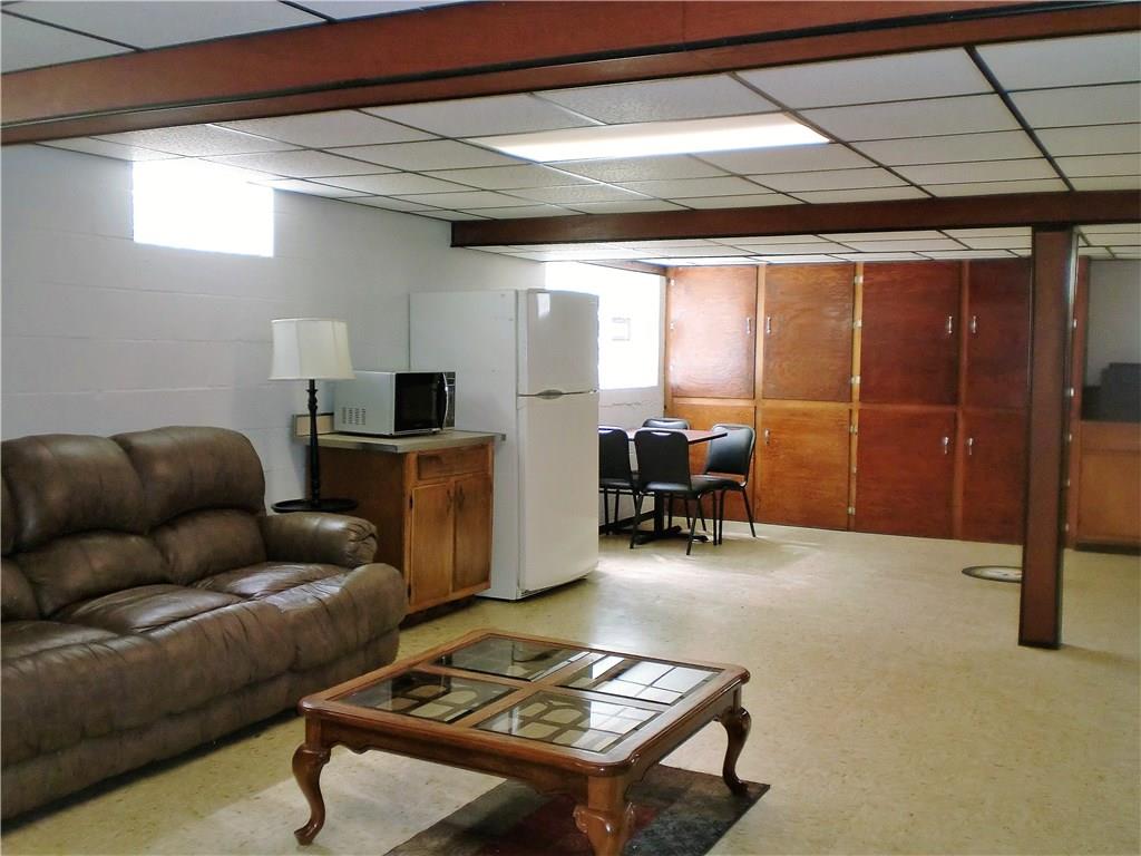 290 Manor Road Wexford, PA 15090 - Photo 4 of 25 The partially finished lower level game room is HUGE at 31x17, with great built-in storage on both sides of the room! There's even a wall safe :) (This fridge is not included in the sale.)