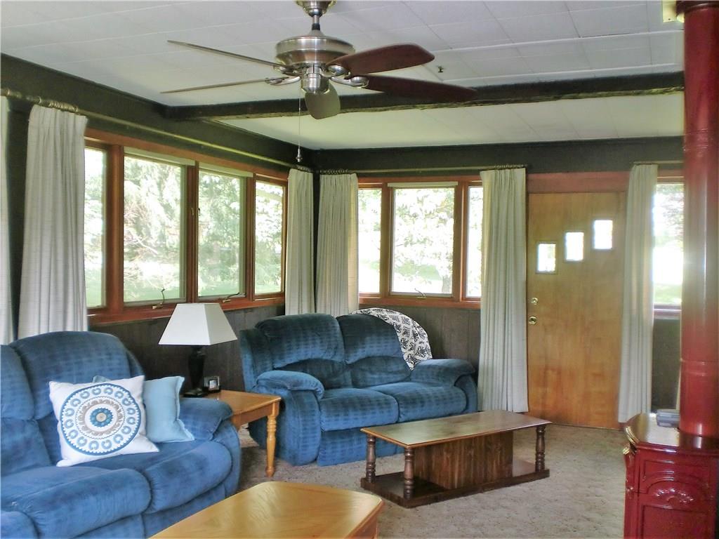 290 Manor Road Wexford, PA 15090 - Photo 6 of 25 The Family Room is surrounded by windows on three sides, opens to the front of the house, and has a ceiling fan and gas heater.