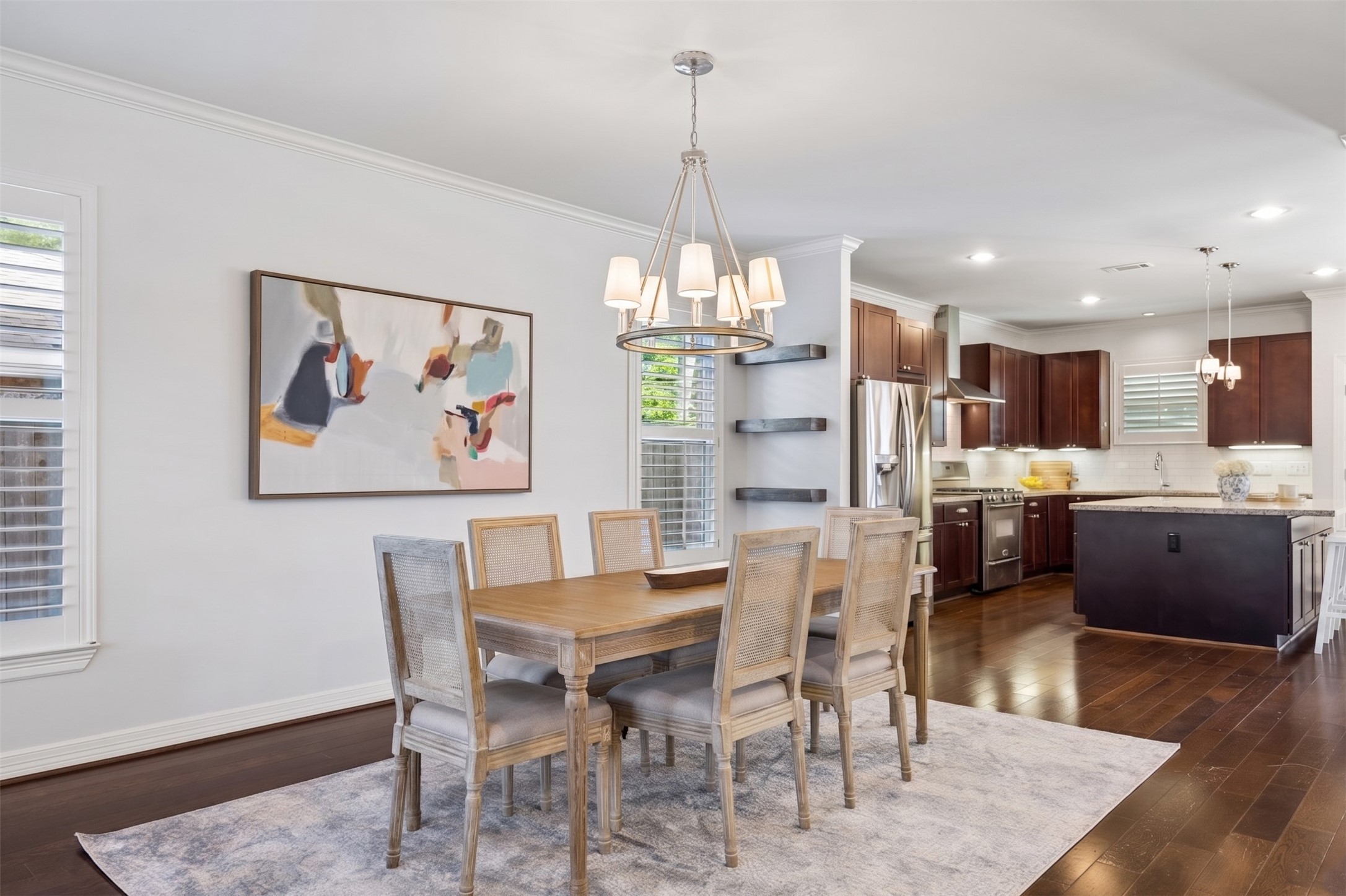 5121 Libbey Drive Houston, TX 77092 - Photo 4 of 24 The formal dining room flows effortlessly into the island kitchen, creating an open, connected space that makes hosting feel easy and natural. Throughout the home, elegant crown molding adds a layer of timeless character.