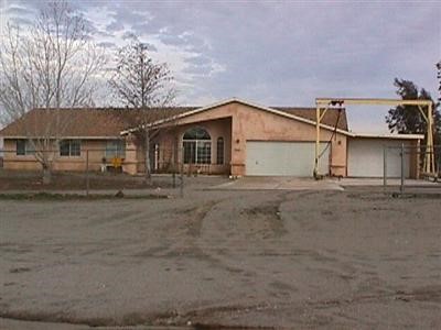 12355 Riggins Road Phelan, CA 92371 - Photo 1 of 1 a view of a house with a outdoor space