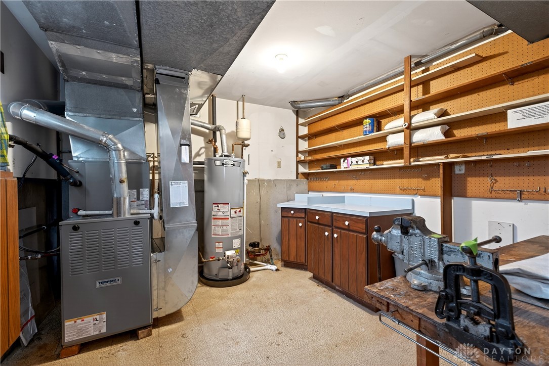 1547 Ambridge Road Centerville, OH 45459 - Photo 55 of 79 This functional basement space offers ample storage and a dedicated work area.