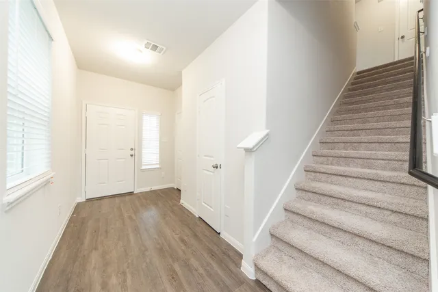 a view of entryway with wooden floor