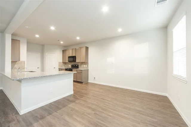 a view of kitchen with wooden floor