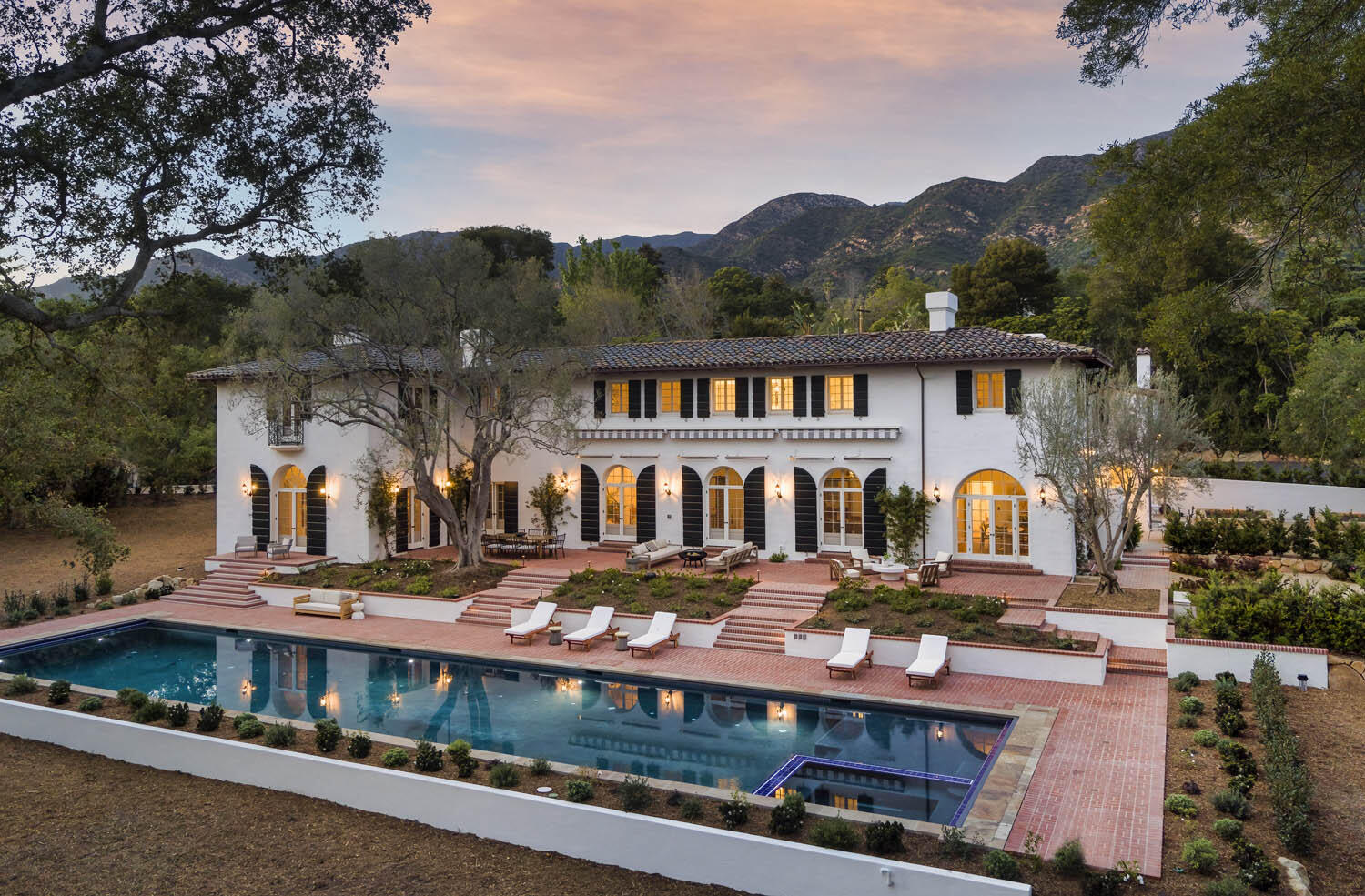 770 Hot Springs Road Montecito, CA 93108 - Photo 2 of 33 a view of a large white building in front of a house