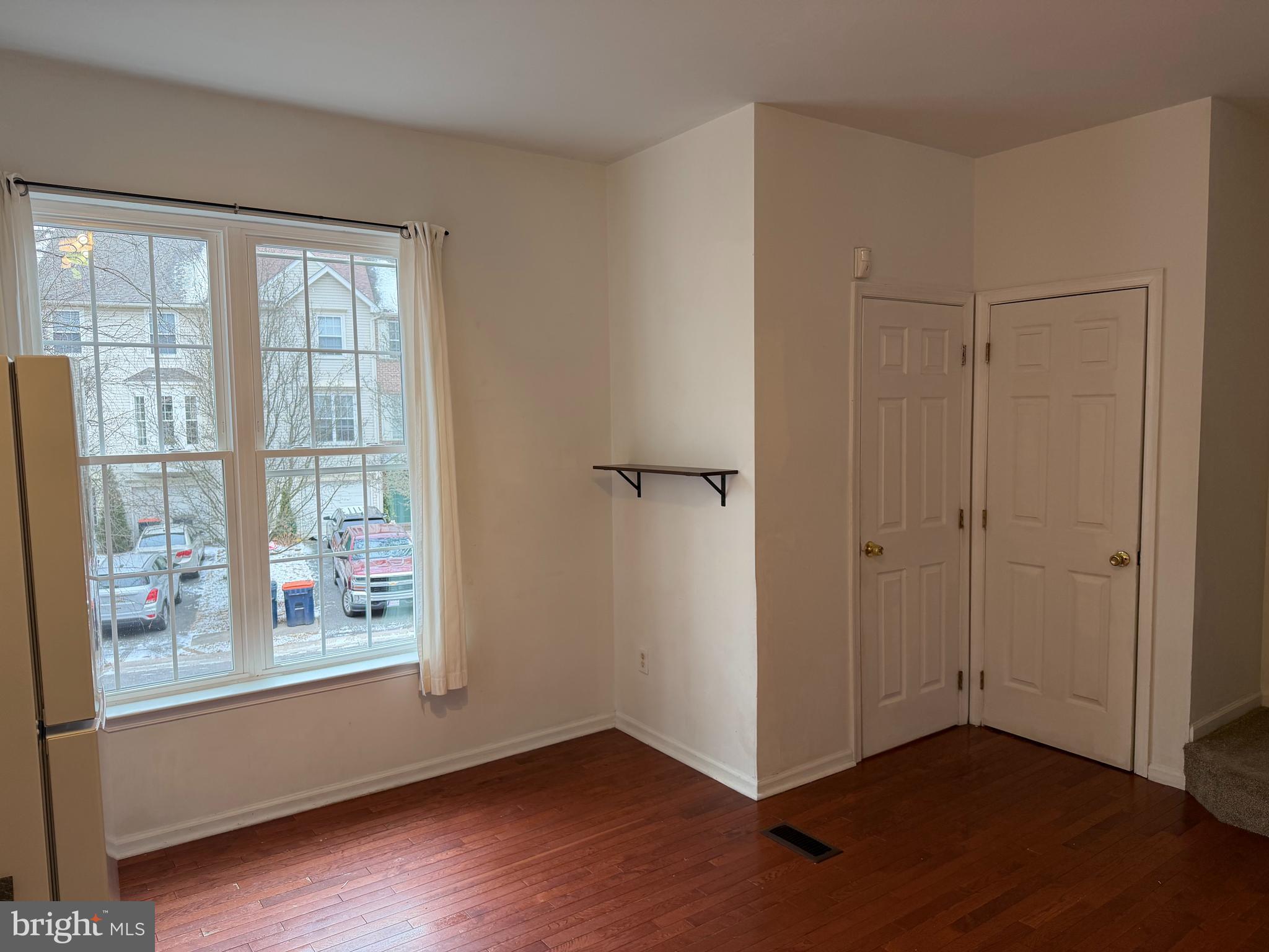 79 Mule Deer Court Elkton, MD 21921 - Photo 11 of 20 a view of an empty room with wooden floor and a window