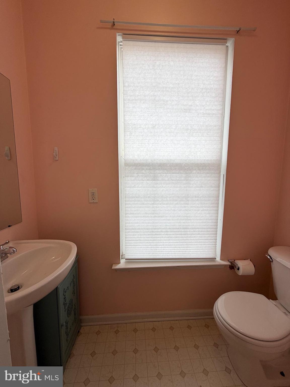 79 Mule Deer Court Elkton, MD 21921 - Photo 12 of 20 a bathroom with a toilet sink and window