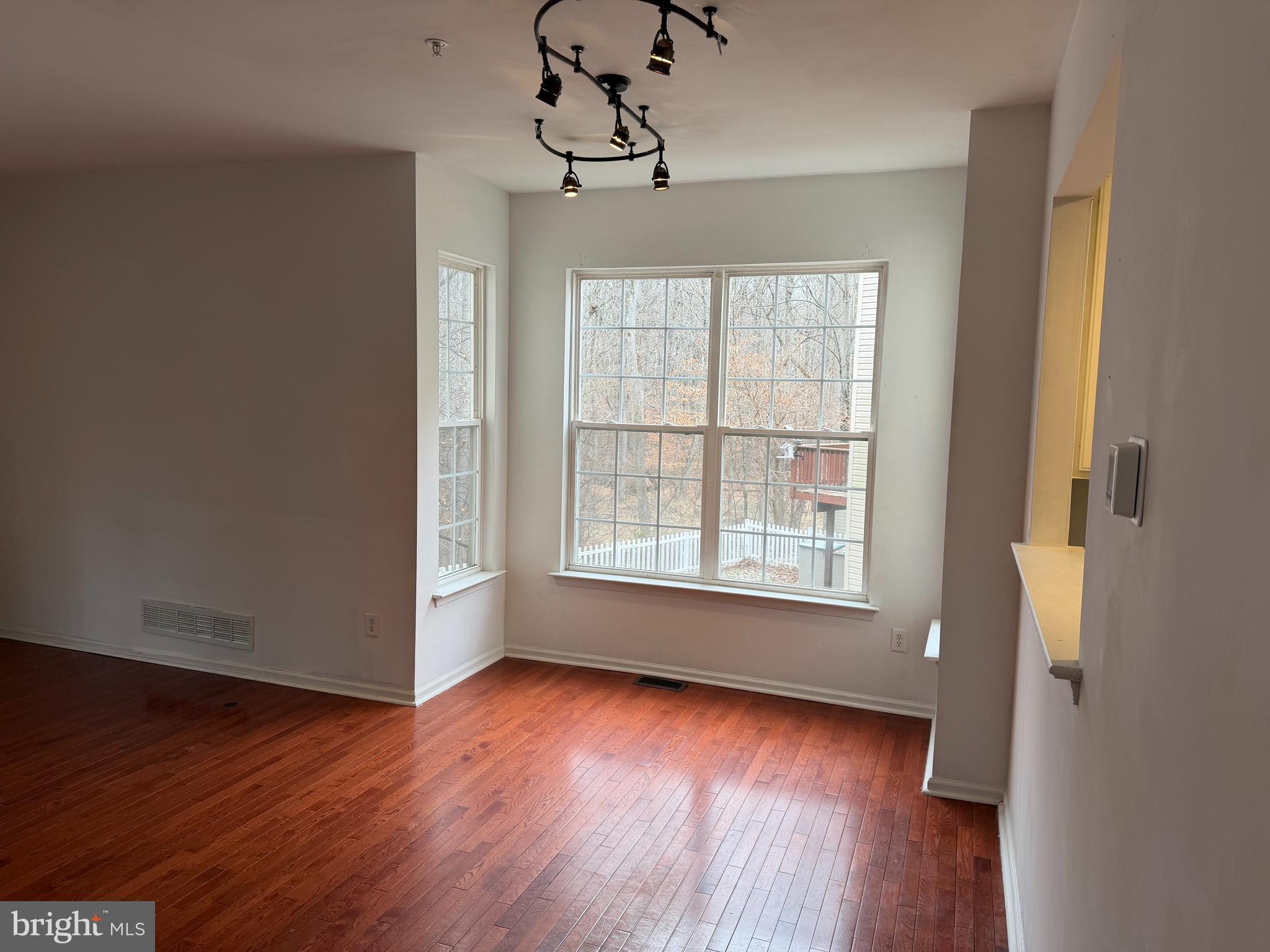 79 Mule Deer Court Elkton, MD 21921 - Photo 8 of 20 a view of an empty room with wooden floor and a window
