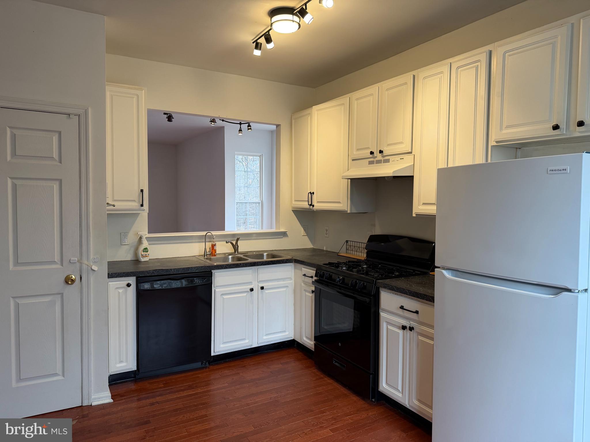 79 Mule Deer Court Elkton, MD 21921 - Photo 10 of 20 a kitchen with granite countertop a sink cabinets and stainless steel appliances
