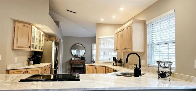 a living room with fireplace furniture and a window