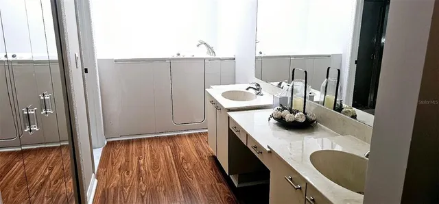 a kitchen with a sink and a stove top oven