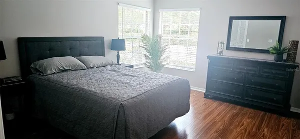 a bedroom with a bed and a dresser